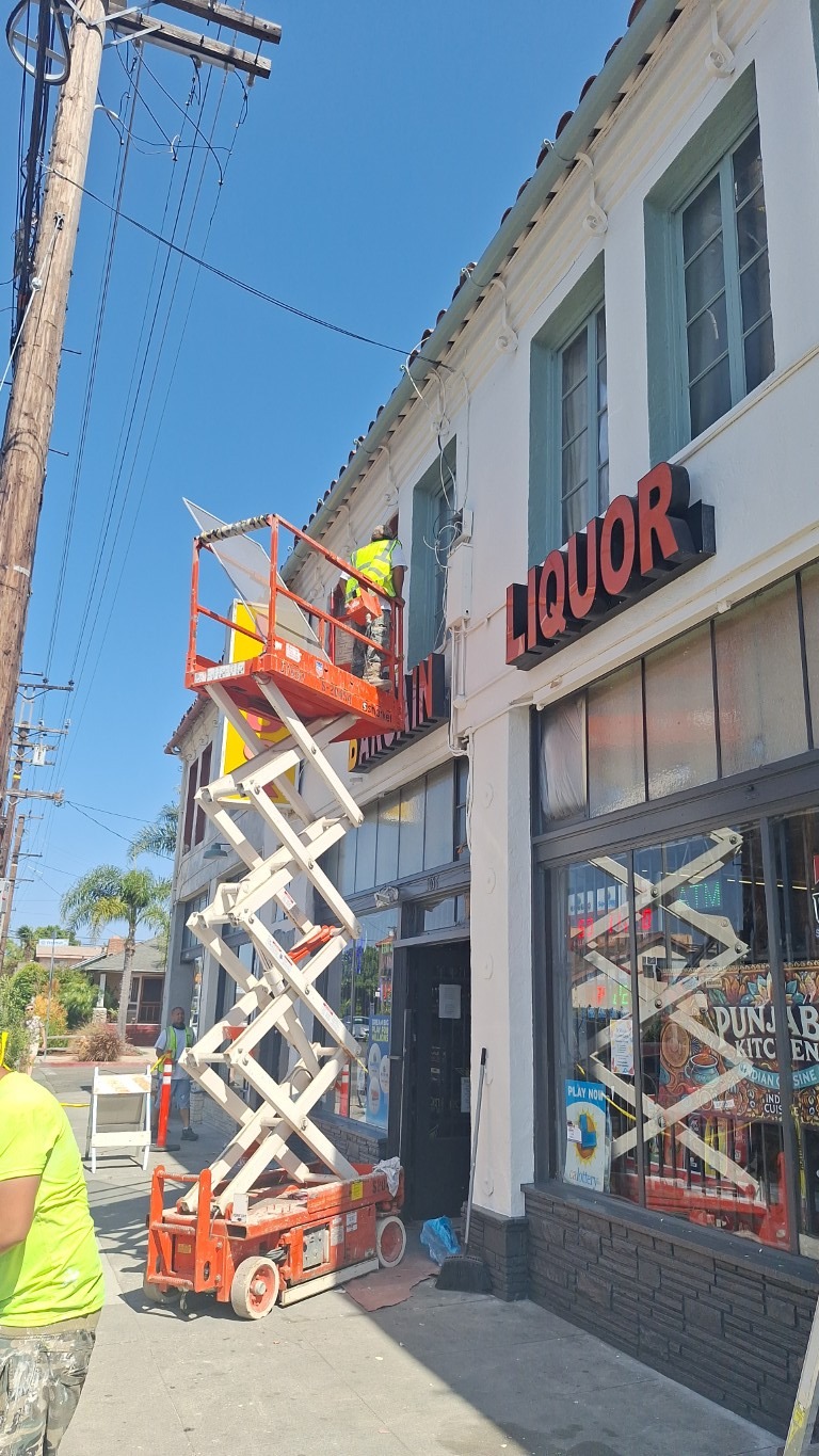 Exterior work underway on a commercial and multifamily property